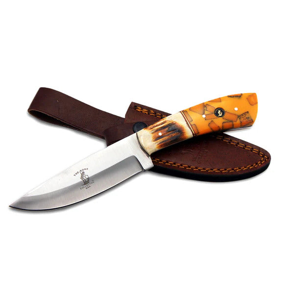 CUCHILLO DE CAZA CON MANGO DE RESINA AMARILLA Y BOVINO QUEMDO